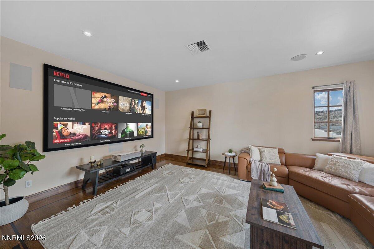 4400 Slide Mountain Circle Reno, NV 89511 - Photo 42 of 79 a living room with furniture and a flat screen tv