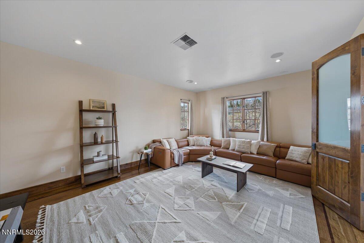 4400 Slide Mountain Circle Reno, NV 89511 - Photo 44 of 79 a living room with furniture and a flat screen tv