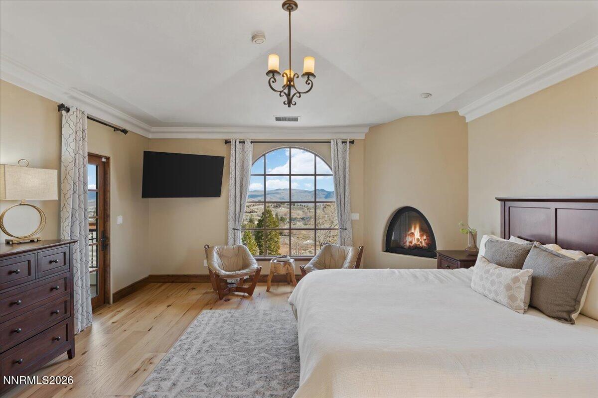 4400 Slide Mountain Circle Reno, NV 89511 - Photo 46 of 79 a bedroom with a large bed and a window
