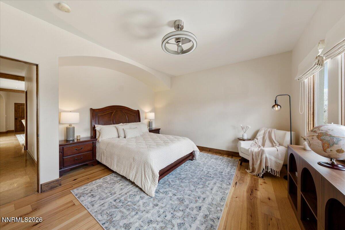 4400 Slide Mountain Circle Reno, NV 89511 - Photo 55 of 93 a bedroom with a bed and a chandelier