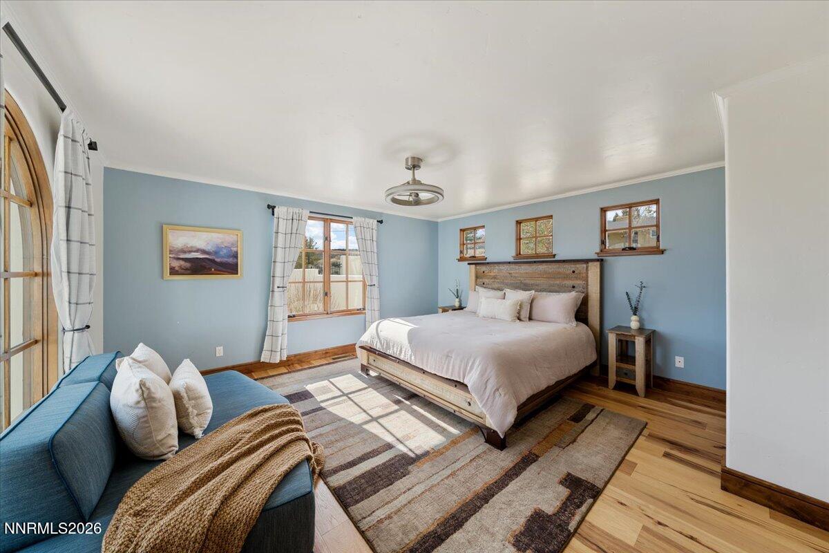 4400 Slide Mountain Circle Reno, NV 89511 - Photo 60 of 93 a bedroom with a bed and wooden floor