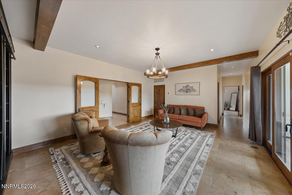 4400 Slide Mountain Circle Reno, NV 89511 - Photo 62 of 79 a living room with furniture chandelier and a fireplace