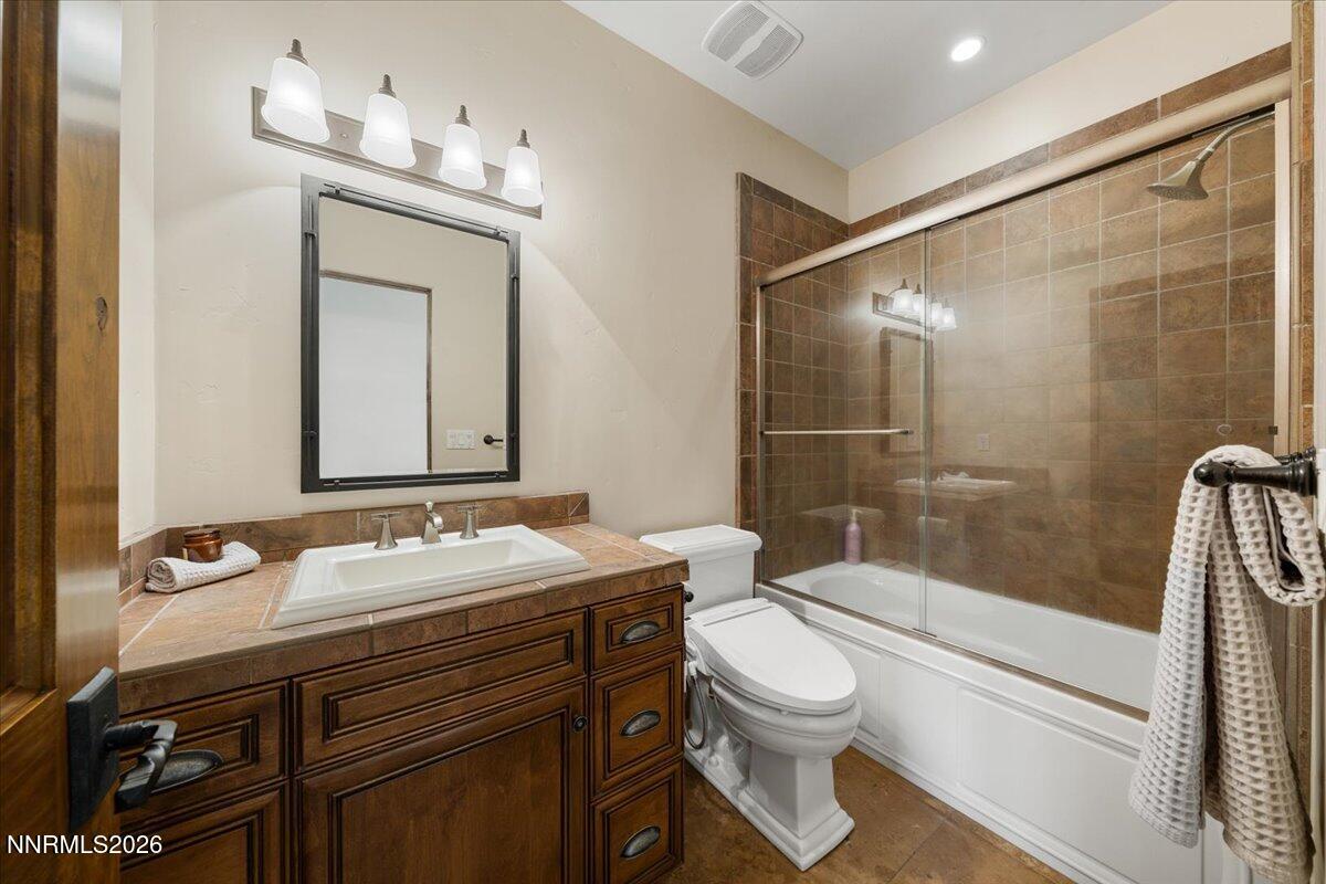 4400 Slide Mountain Circle Reno, NV 89511 - Photo 67 of 79 a bathroom with a sink a toilet and shower