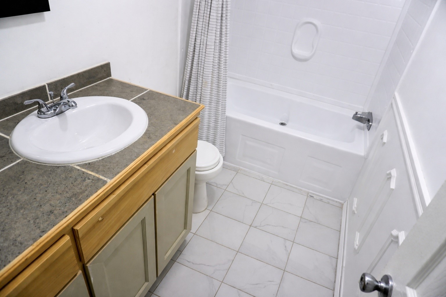 26331 Pinion Creek Road Magnolia, TX 77355 - Photo 13 of 14 a bathroom with a sink a toilet and shower