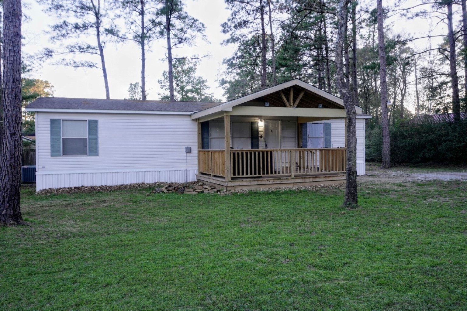 26331 Pinion Creek Road Magnolia, TX 77355 - Photo 2 of 14 a front view of a house with garden