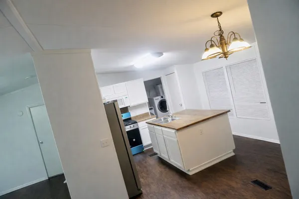 a room with cabinets and wooden floor