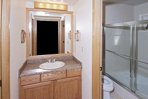931 Singletree Road, Unit 17 Edwards, CO 81632 - Photo 11 of 11 a bathroom with a granite countertop shower and a sink