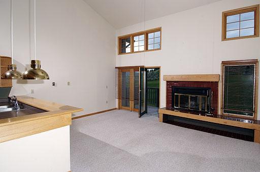 931 Singletree Road, Unit 17 Edwards, CO 81632 - Photo 4 of 11 a view of an empty room with fireplace and a window