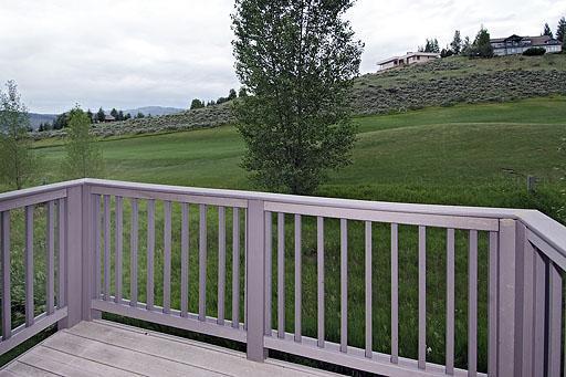 931 Singletree Road, Unit 17 Edwards, CO 81632 - Photo 8 of 11 a view of a wooden deck and a yard with wooden fence