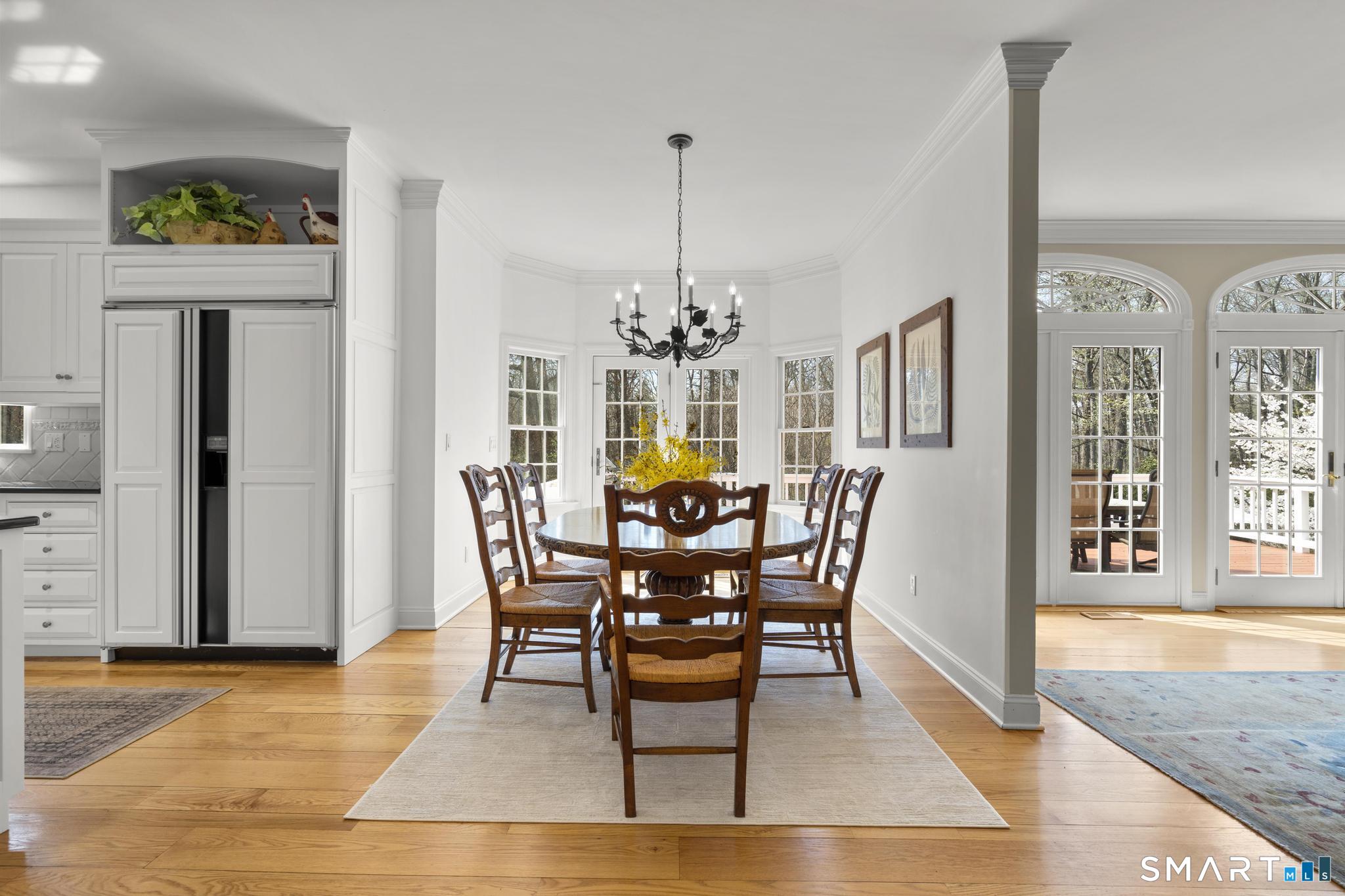 8 Maplewood Lane Wilton, CT 06897 - Photo 11 of 40 a dining room with furniture window and wooden floor