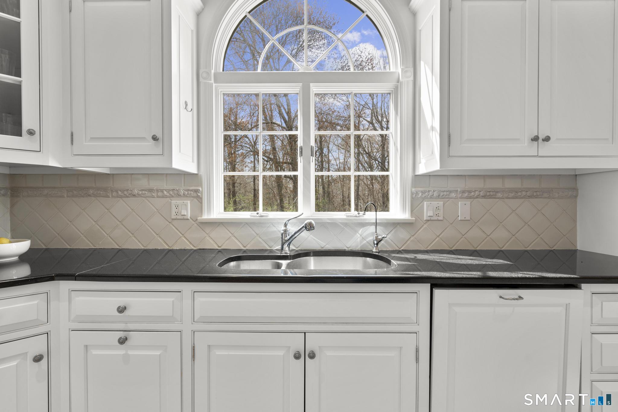8 Maplewood Lane Wilton, CT 06897 - Photo 12 of 40 a kitchen with granite countertop white cabinets and a sink