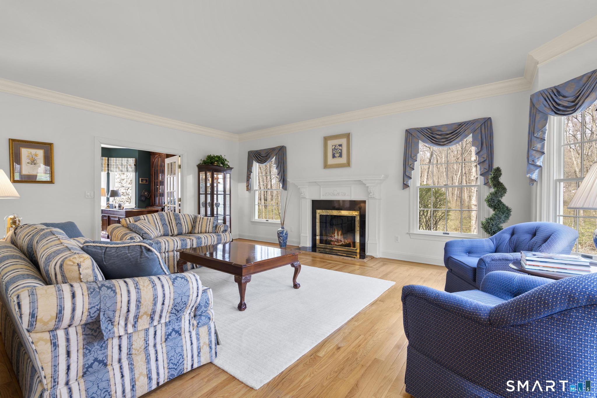 8 Maplewood Lane Wilton, CT 06897 - Photo 13 of 40 a living room with furniture fireplace and window