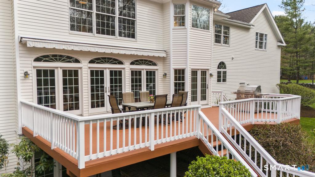 8 Maplewood Lane Wilton, CT 06897 - Photo 15 of 40 a view of a house with deck and deck