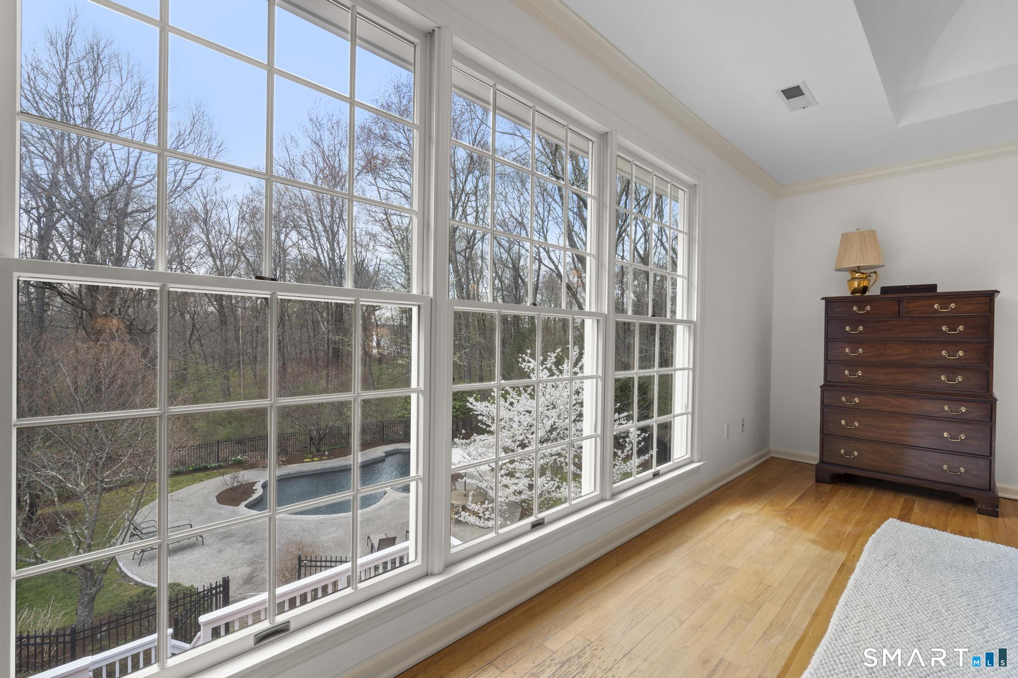 8 Maplewood Lane Wilton, CT 06897 - Photo 18 of 40 a view of a room with wooden floor and windows