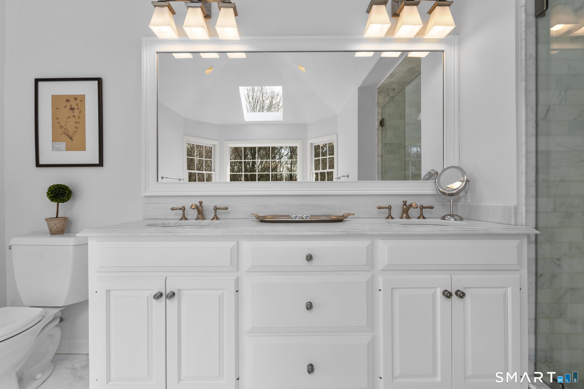 8 Maplewood Lane Wilton, CT 06897 - Photo 20 of 40 a bathroom with double sink and a mirror