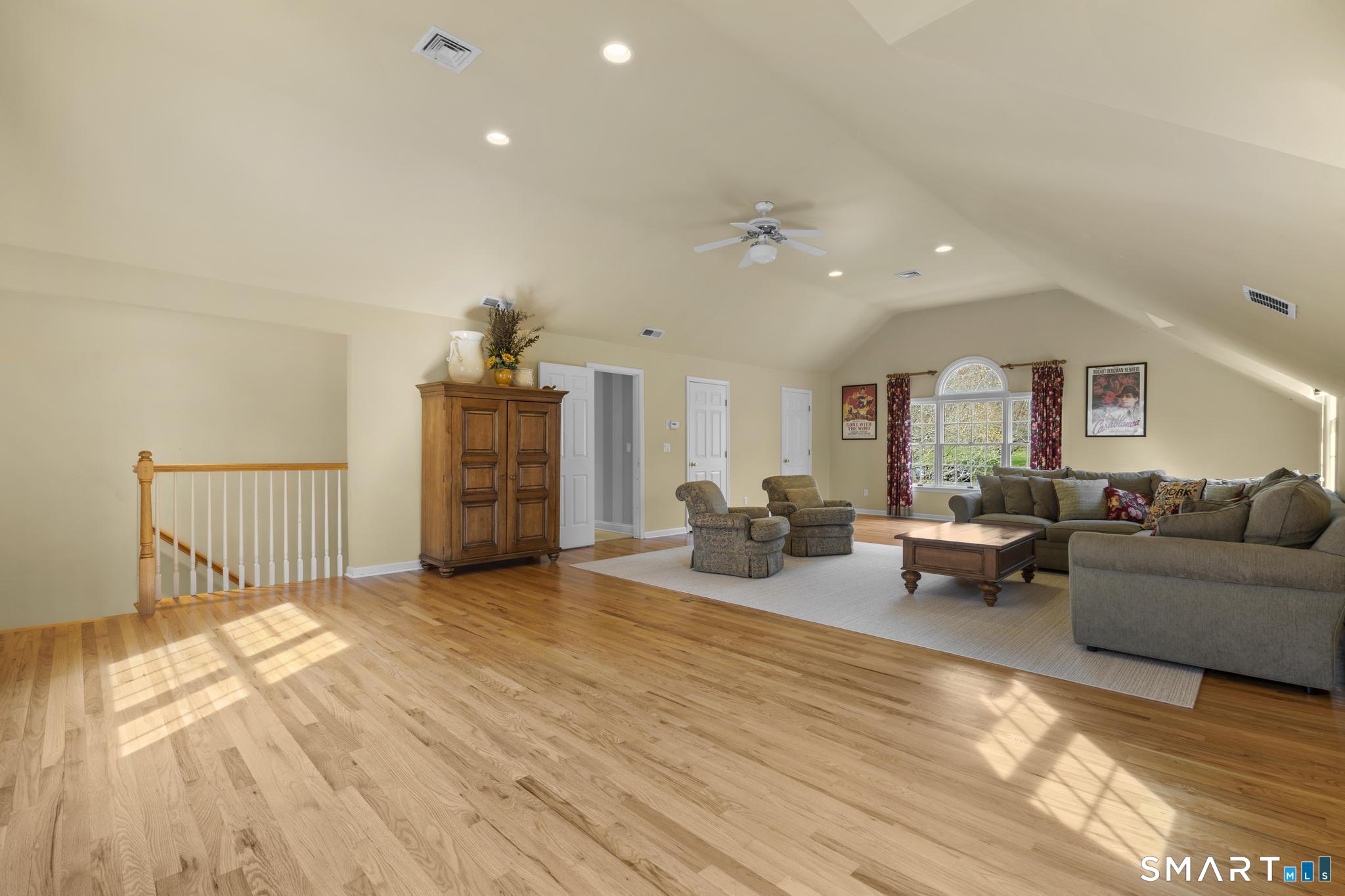 8 Maplewood Lane Wilton, CT 06897 - Photo 28 of 40 a living room with furniture and wooden floor