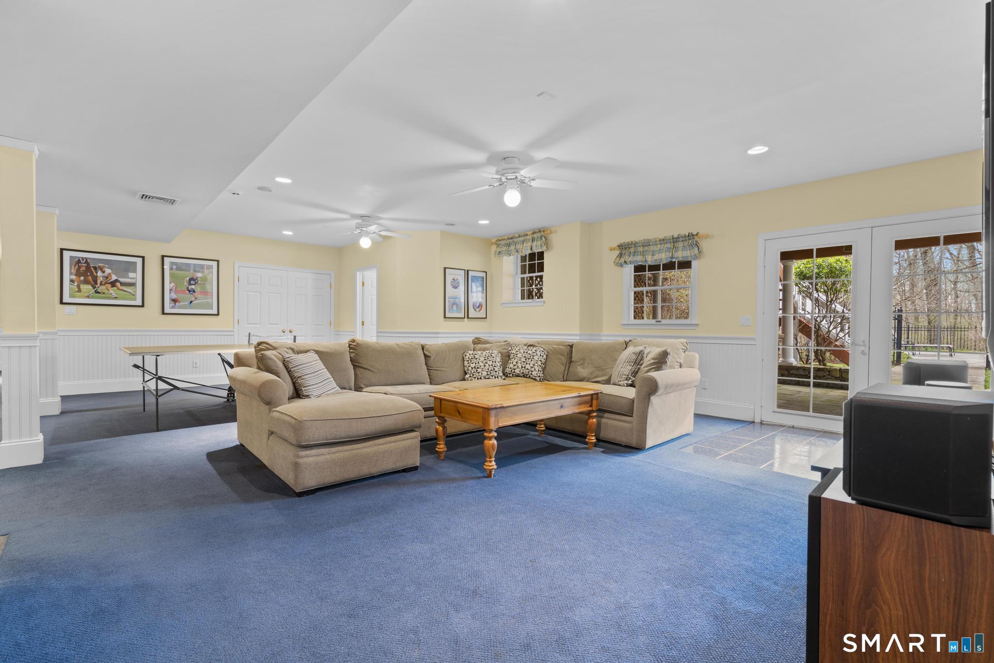 8 Maplewood Lane Wilton, CT 06897 - Photo 33 of 40 a living room with furniture and a large window