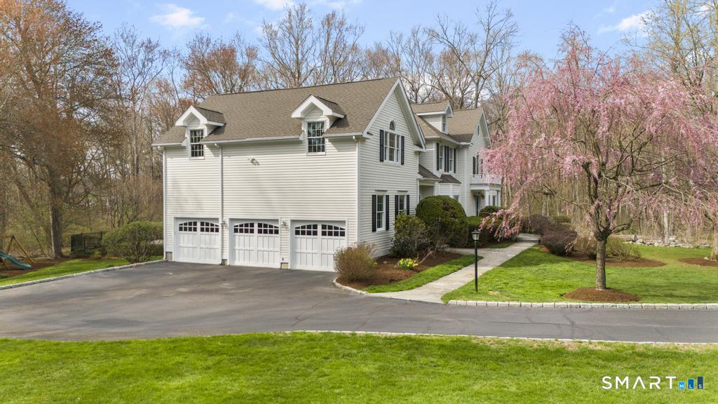 8 Maplewood Lane Wilton, CT 06897 - Photo 34 of 40 a view of a house with a yard