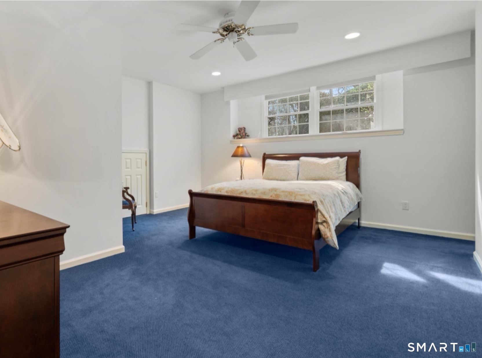 8 Maplewood Lane Wilton, CT 06897 - Photo 37 of 40 a bedroom with a bed and a night stand