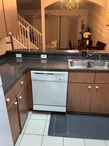 a kitchen with a cabinets and window