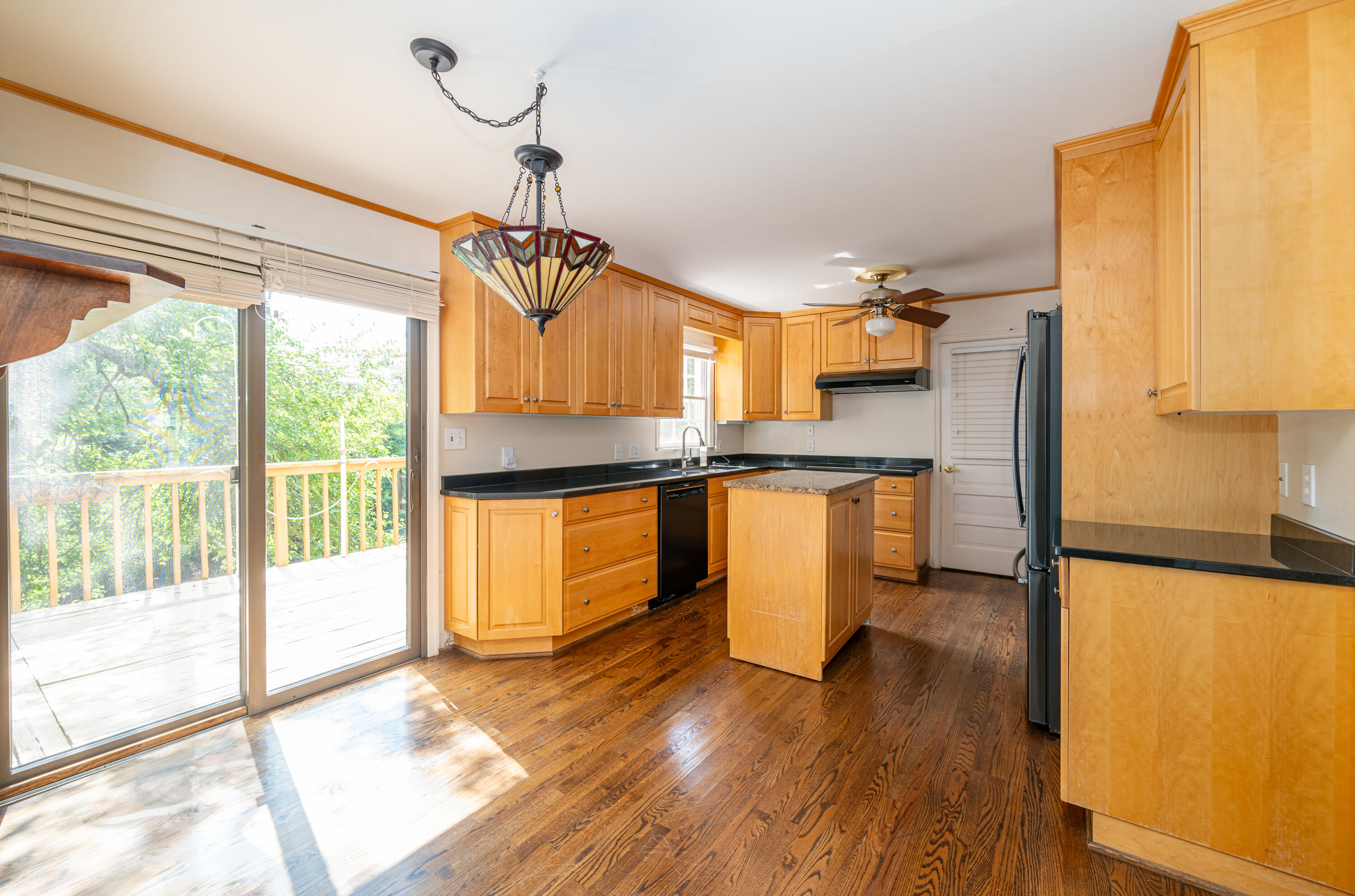 803 Red Lane Salem, VA 24153 - Photo 5 of 24 a kitchen with kitchen island granite countertop a stove a sink and a refrigerator