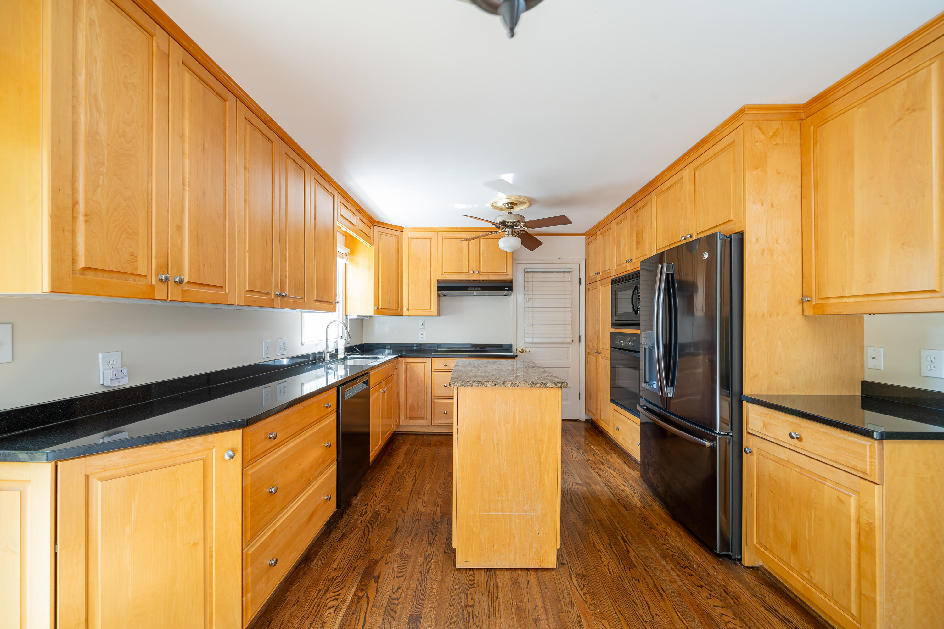 803 Red Lane Salem, VA 24153 - Photo 6 of 24 a kitchen with stainless steel appliances granite countertop a refrigerator a stove and a wooden floor