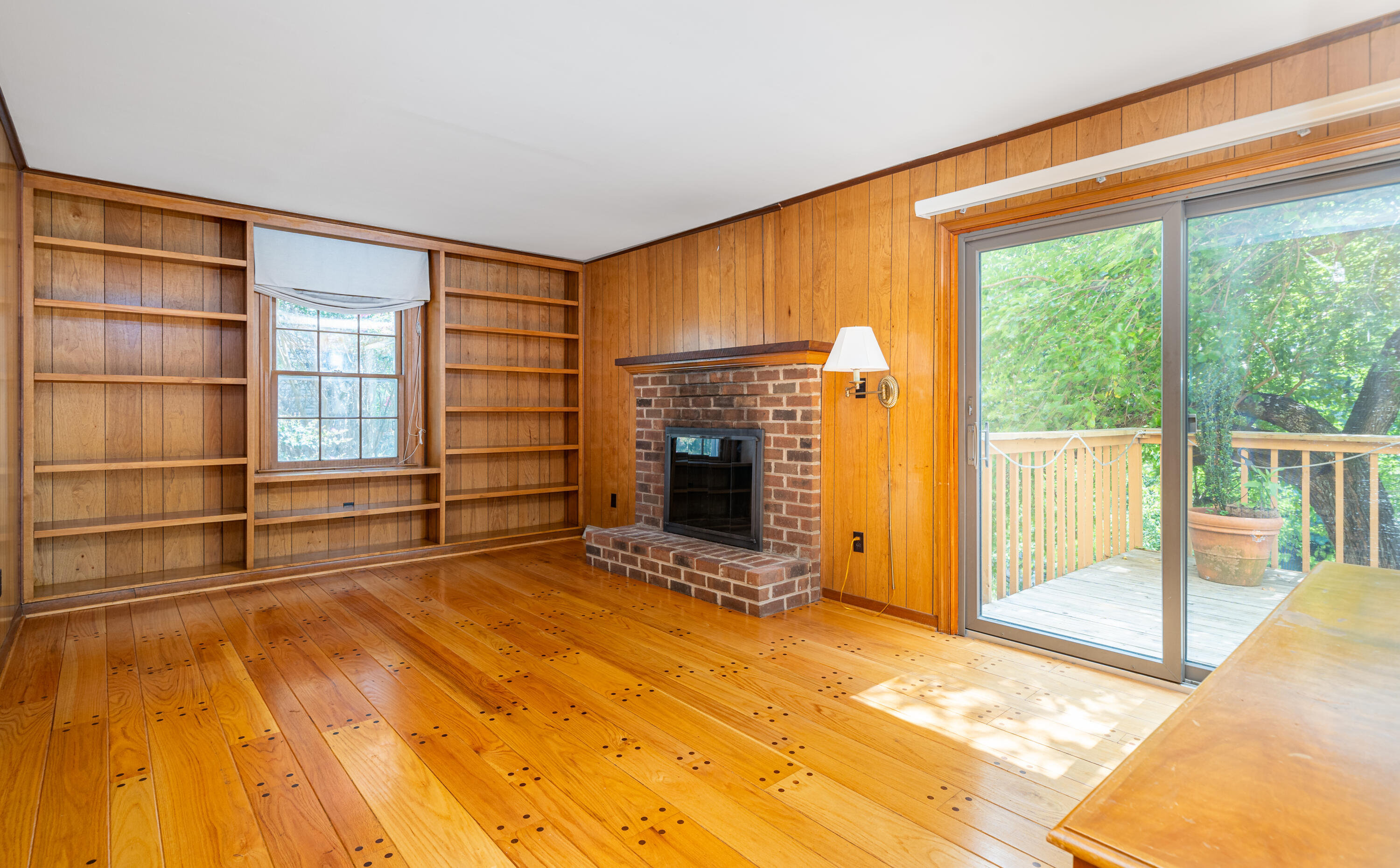 803 Red Lane Salem, VA 24153 - Photo 7 of 24 a view of an empty room with a fireplace and a window