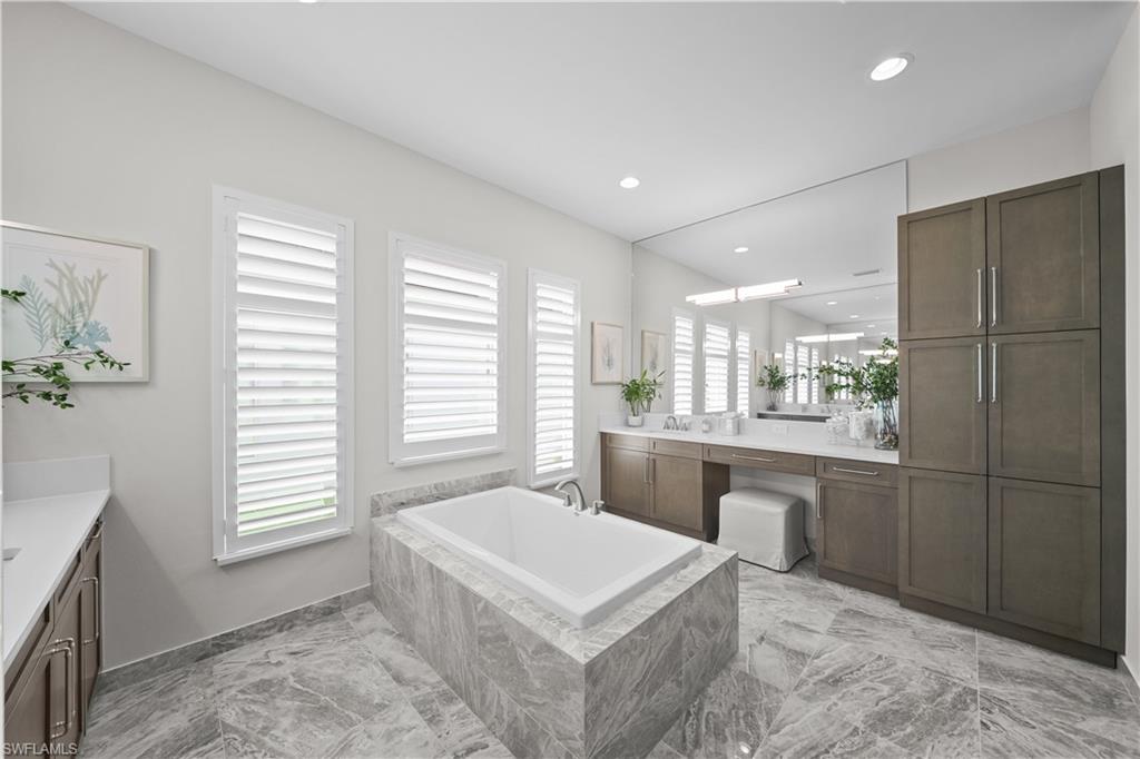 12092 Eucalyptus Way Naples, FL 34120 - Photo 17 of 50 a kitchen with a sink cabinets and window