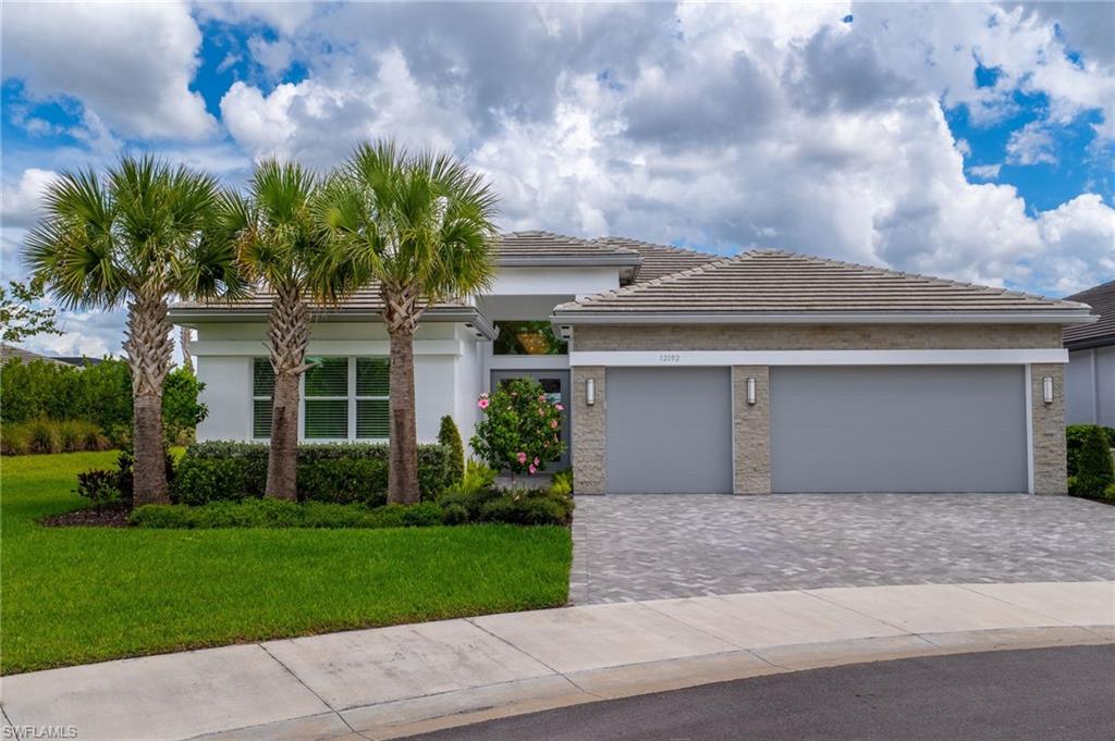 12092 Eucalyptus Way Naples, FL 34120 - Photo 2 of 50 a front view of house with yard
