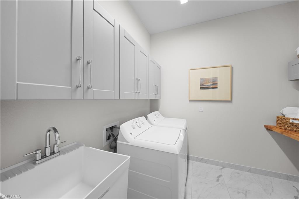 12092 Eucalyptus Way Naples, FL 34120 - Photo 25 of 50 a utility room with sink dryer and washer