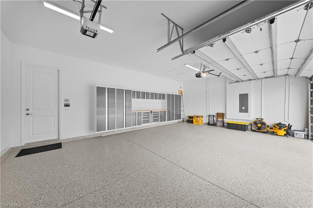 12092 Eucalyptus Way Naples, FL 34120 - Photo 26 of 50 a view of empty room with garage