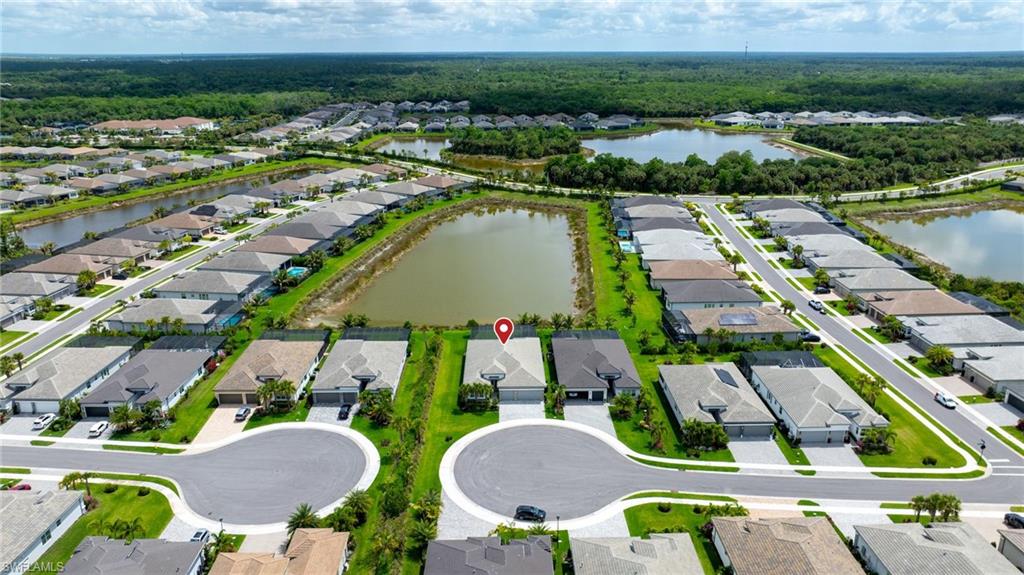 12092 Eucalyptus Way Naples, FL 34120 - Photo 33 of 50 an aerial view of residential houses with outdoor space and river