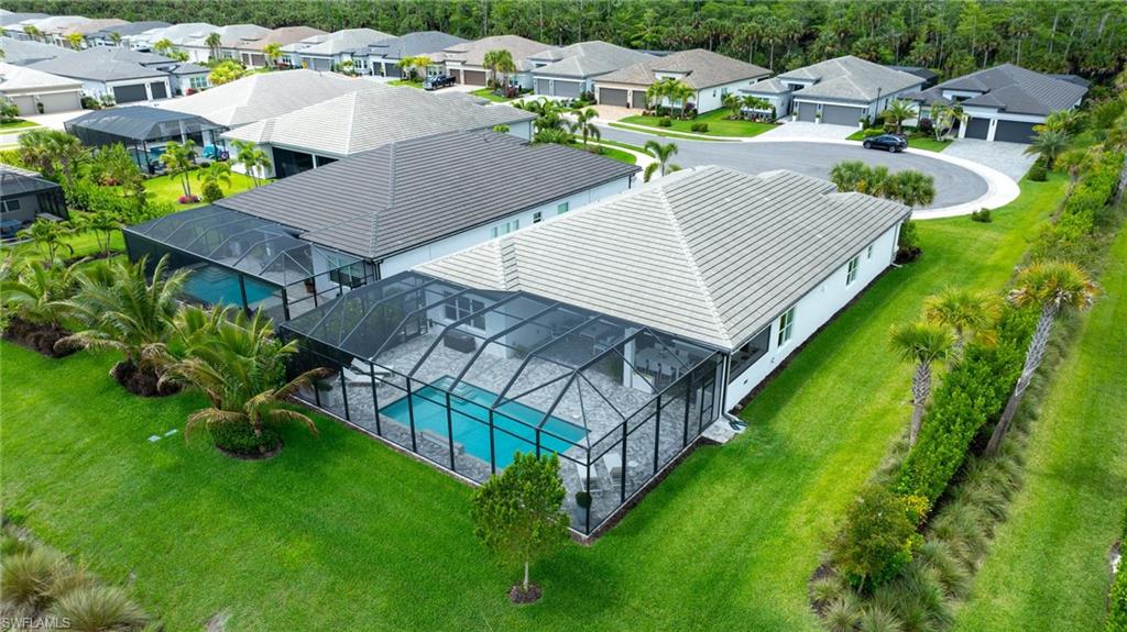 12092 Eucalyptus Way Naples, FL 34120 - Photo 36 of 50 an aerial view of residential house with outdoor space and street view