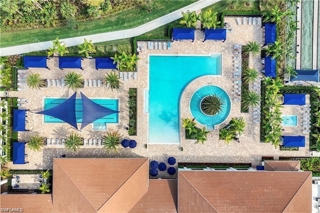 12092 Eucalyptus Way Naples, FL 34120 - Photo 39 of 50 an aerial view of a house with a yard and large tree