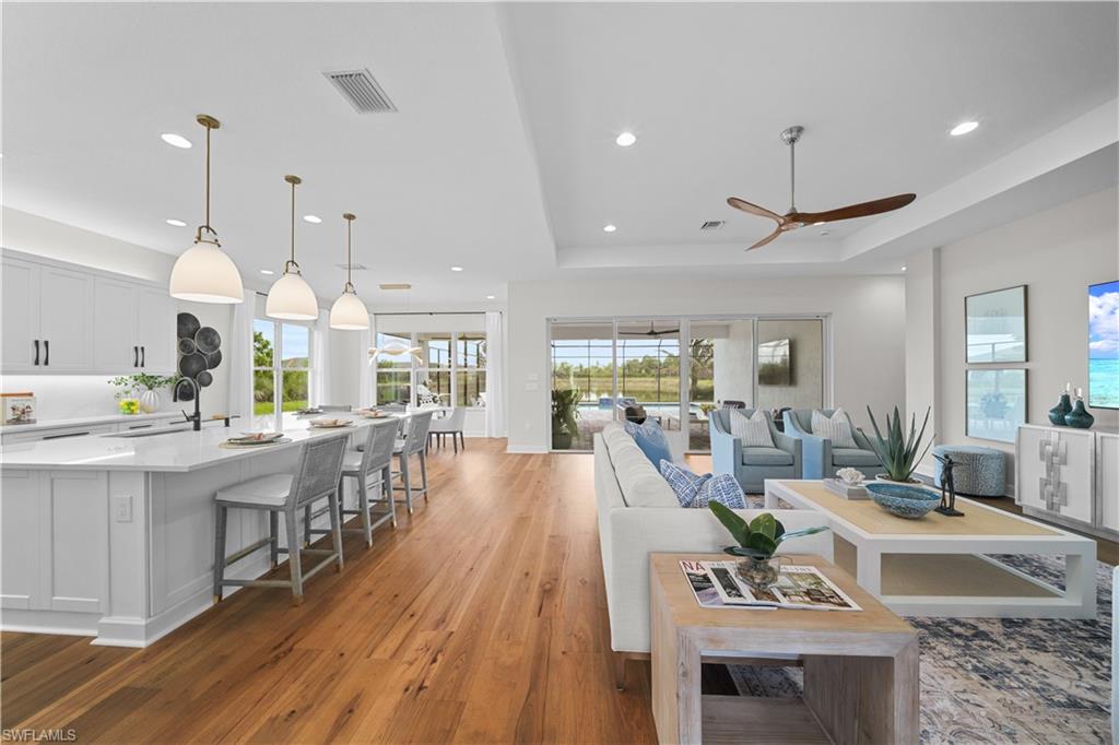 12092 Eucalyptus Way Naples, FL 34120 - Photo 4 of 50 a view of a kitchen and dining room