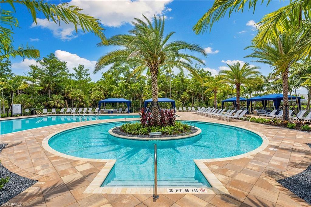 12092 Eucalyptus Way Naples, FL 34120 - Photo 41 of 50 a view of a swimming pool with a patio