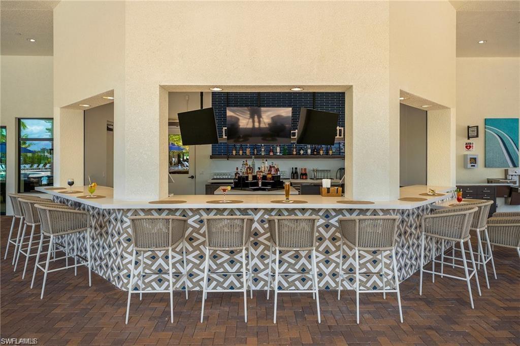 12092 Eucalyptus Way Naples, FL 34120 - Photo 42 of 50 a view of a dining room with furniture
