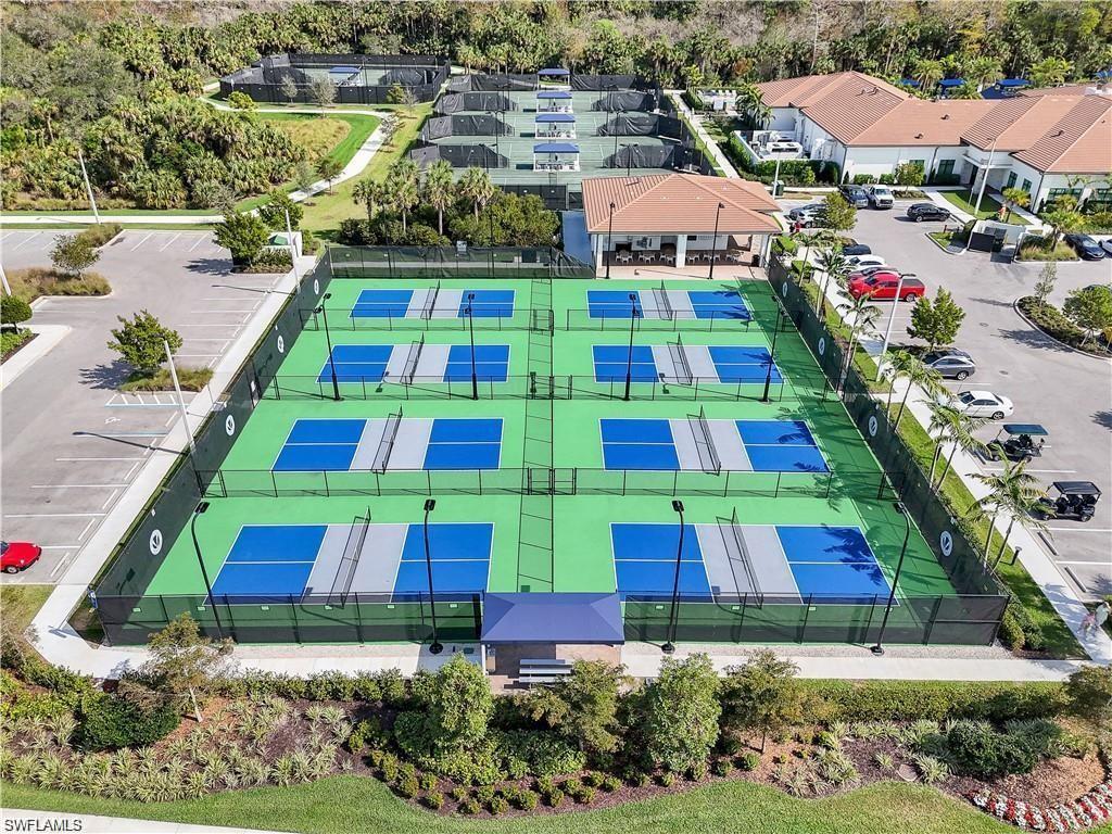 12092 Eucalyptus Way Naples, FL 34120 - Photo 49 of 50 an aerial view of multiple houses with yard