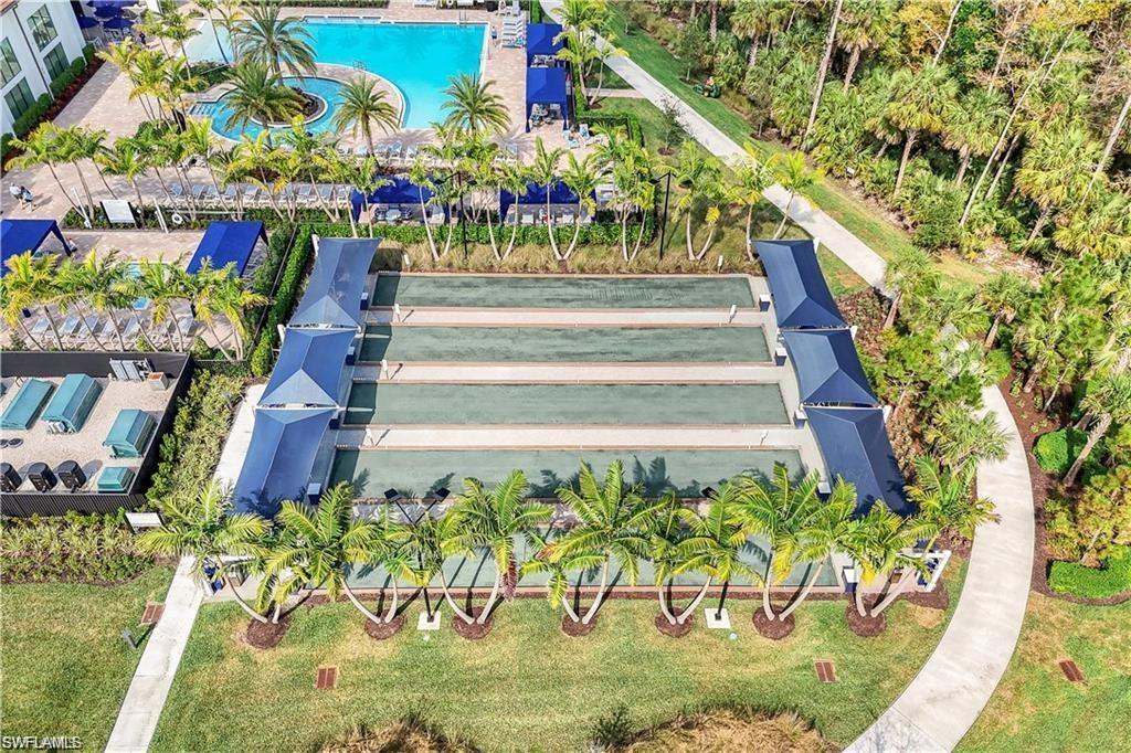 12092 Eucalyptus Way Naples, FL 34120 - Photo 50 of 50 a front view of a multi story building with a yard