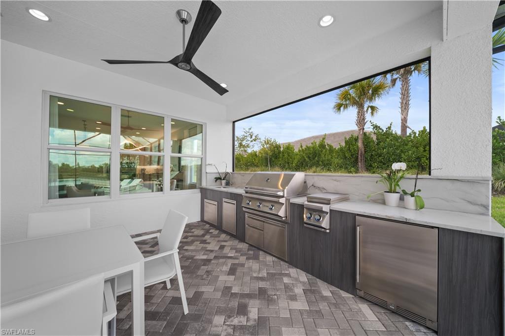 12092 Eucalyptus Way Naples, FL 34120 - Photo 9 of 50 a kitchen with lots of counter top space