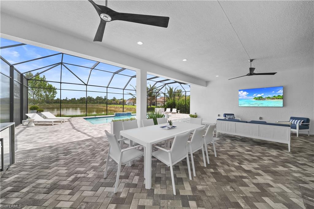 12092 Eucalyptus Way Naples, FL 34120 - Photo 10 of 50 a view of a dining room with furniture wooden floor and a rug