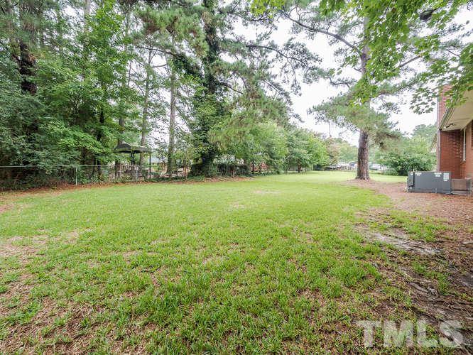 3607 North New Hope Road Raleigh, NC 27604 - Photo 22 of 24 a view of a field with a trees in the background