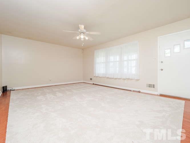 3607 North New Hope Road Raleigh, NC 27604 - Photo 7 of 24 an empty room with a empty space and a ceiling fan