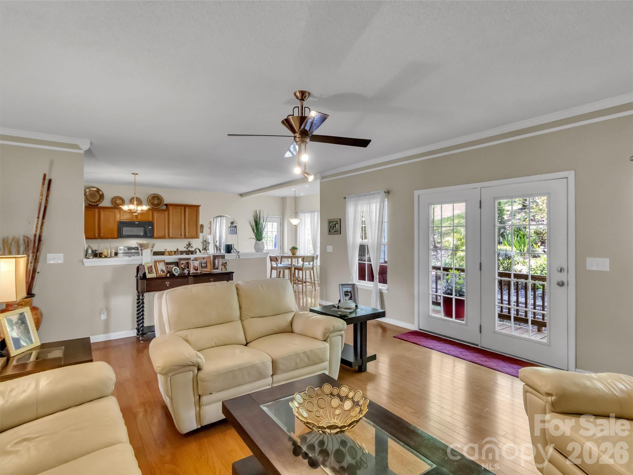 237 Midway Crossing Drive Clyde, NC 28721 - Photo 13 of 42 a living room with furniture and a large window