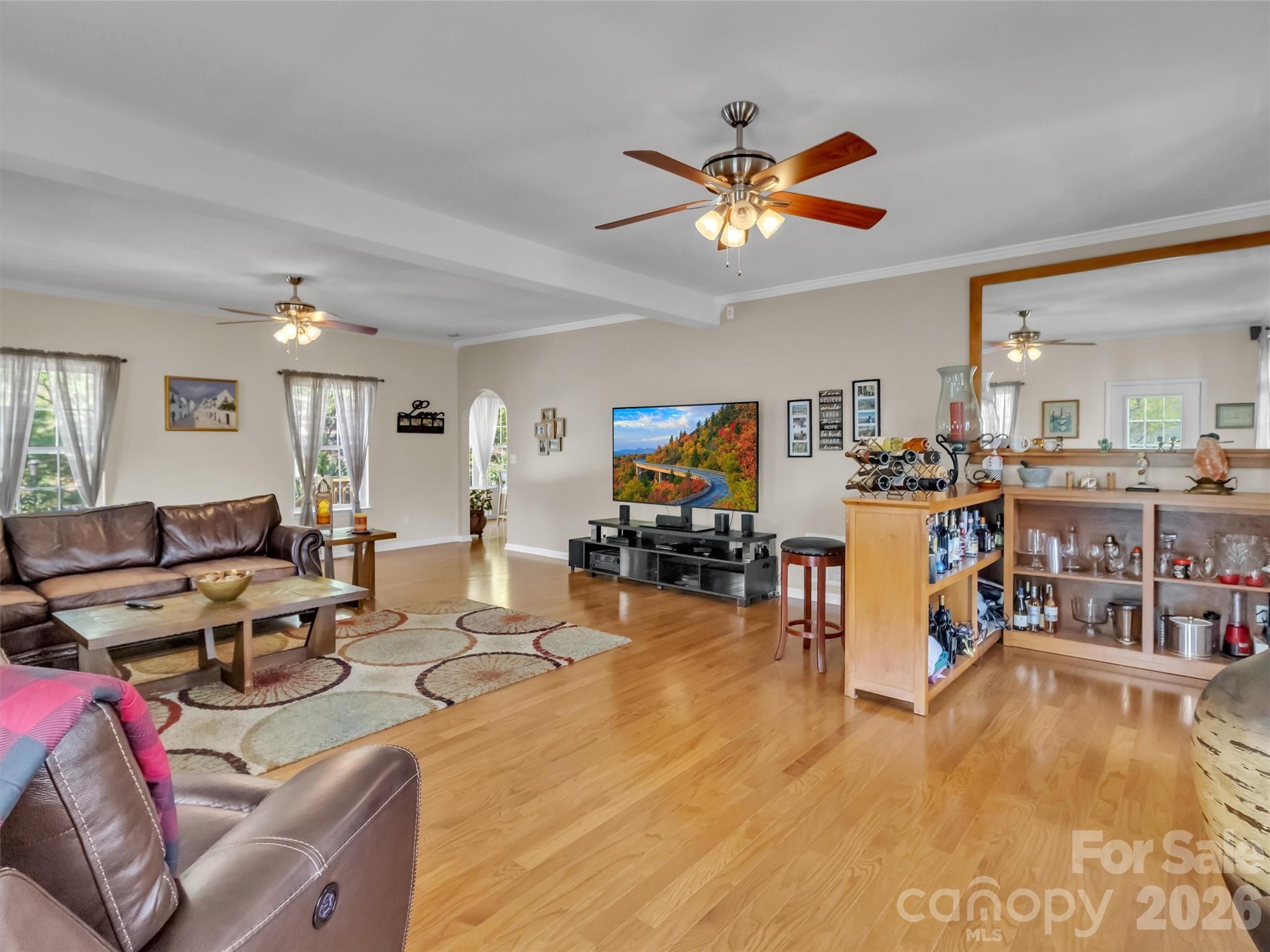 237 Midway Crossing Drive Clyde, NC 28721 - Photo 18 of 42 a living room with furniture and kitchen view