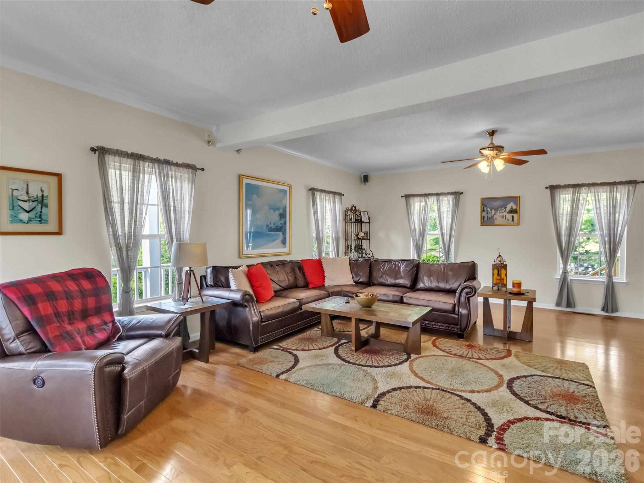 237 Midway Crossing Drive Clyde, NC 28721 - Photo 19 of 42 a living room with furniture and a window