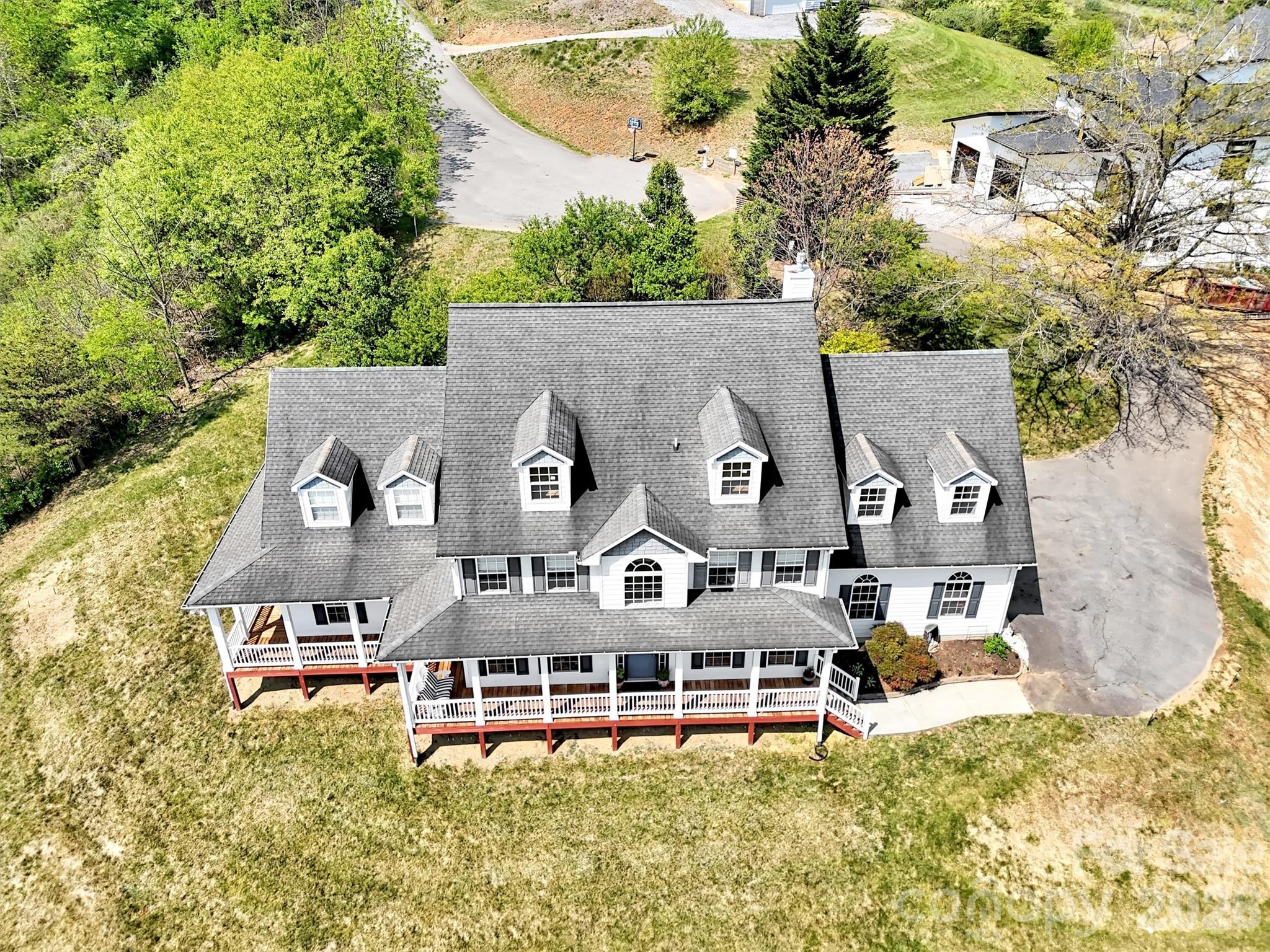 237 Midway Crossing Drive Clyde, NC 28721 - Photo 39 of 42 an aerial view of a house with swimming pool and large trees