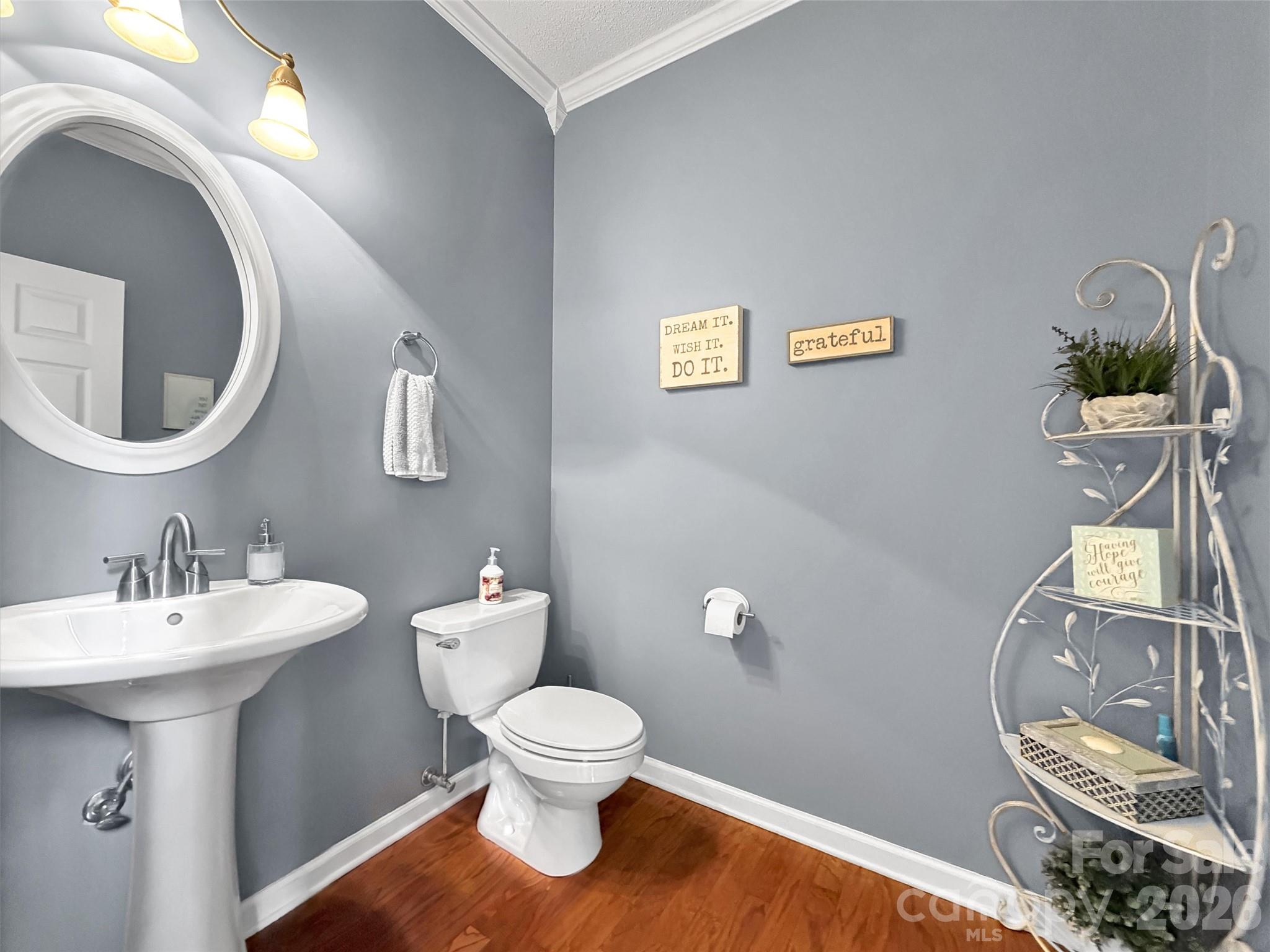 237 Midway Crossing Drive Clyde, NC 28721 - Photo 10 of 42 a bathroom with a toilet sink and mirror