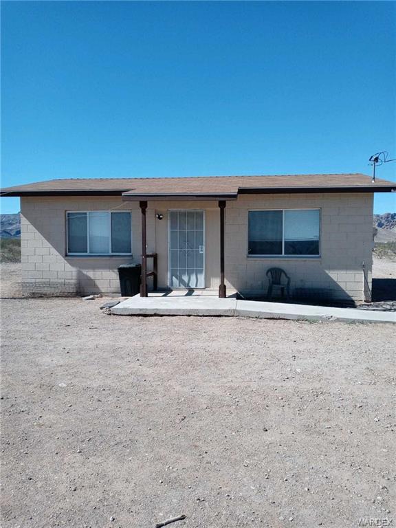 3128 South Jade Road Golden Valley, AZ 86413 - Photo 1 of 1 a front view of a house with a yard and garage