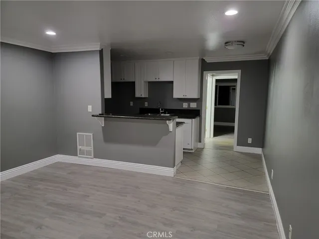 a kitchen with stainless steel appliances a refrigerator and a stove top oven